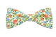 Nœud papillon fleuri aux tons orange et turquoise, une explosion de couleurs pour un style vivant et estival